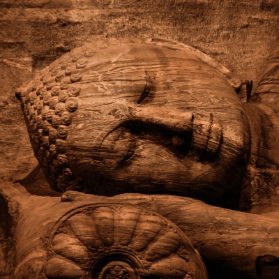 how to meditate spiritually at IMCW, image of Buddha carved into wood